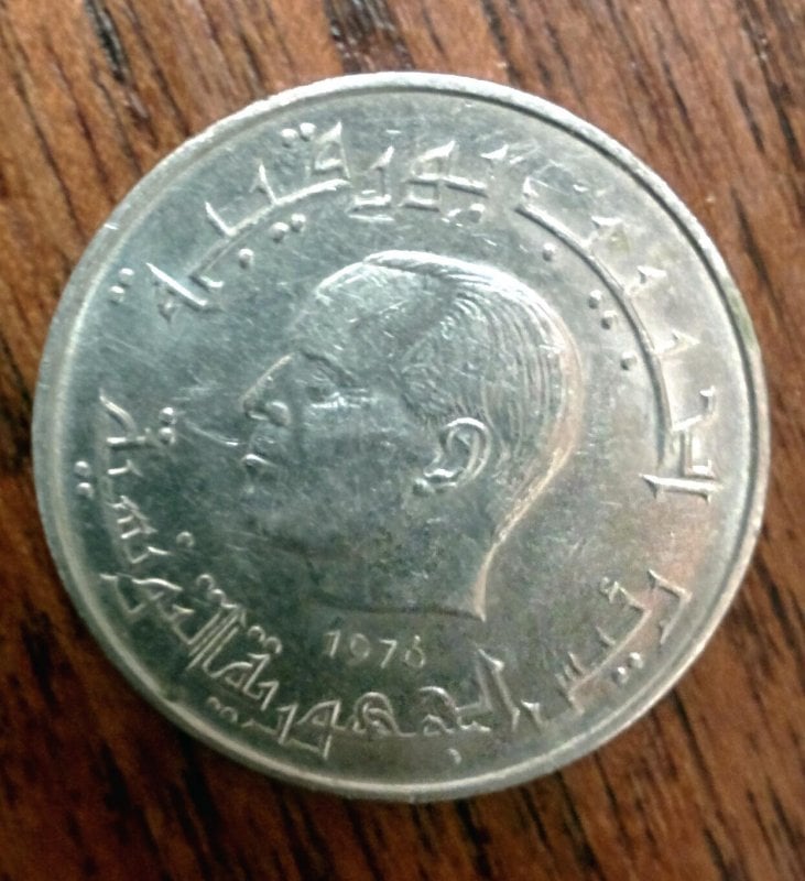 Does anyone know where this coin is from? We're having trouble identifying it.