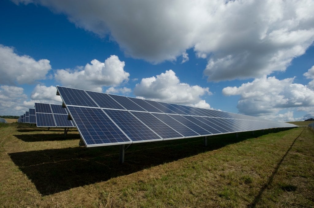 Solar panels arranged in a field.