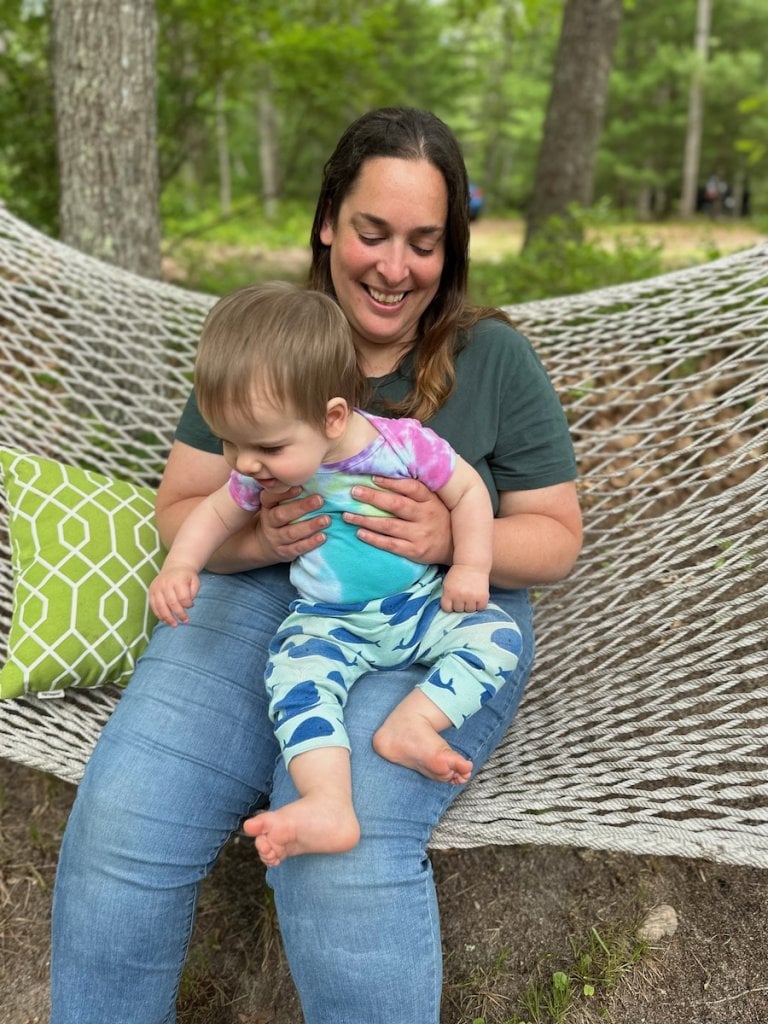 Hannah Werdmuller holding the author's baby on a hammock.