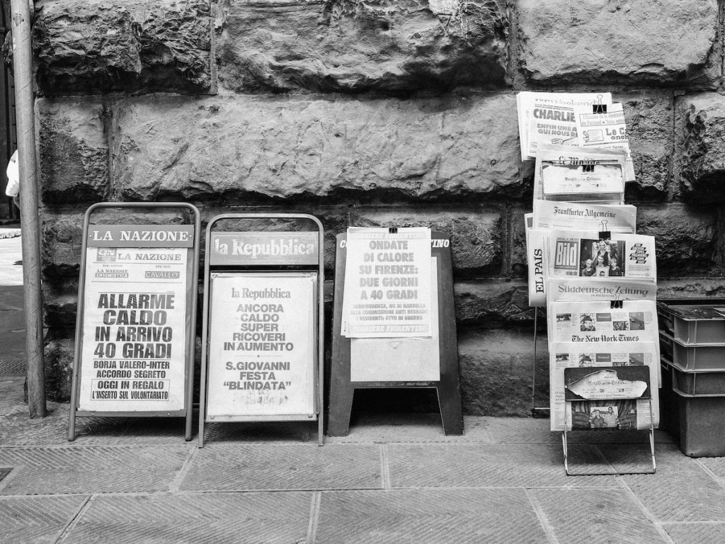 An array of newspapers on sale