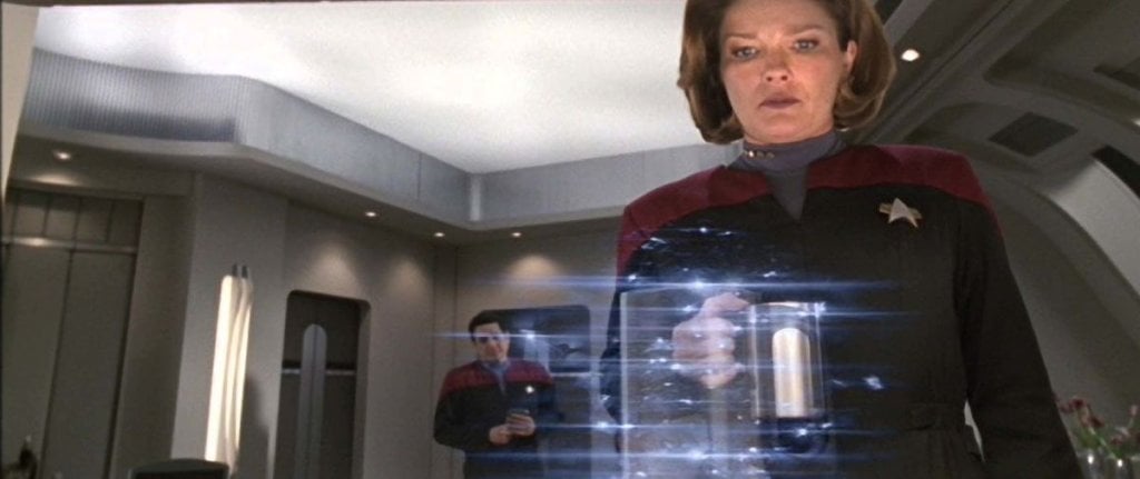 Captain Janeway uses a replicator